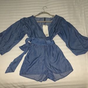 Romper. Never worn.